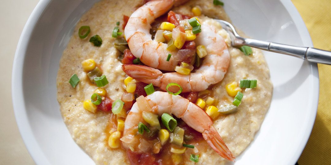 Shrimp and grits in white bowl