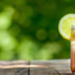 Sweet tea in glass on wooden table