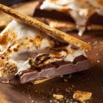 S'more on wooden plate.